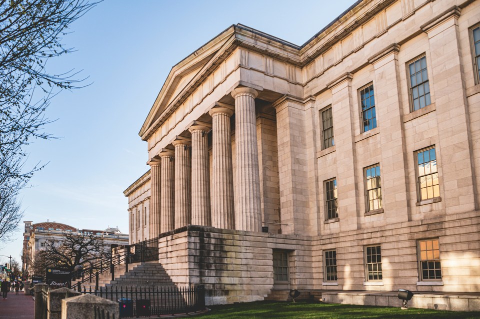 Neoclassical building with grand columns — exchanges as the institutional backbone of betting markets